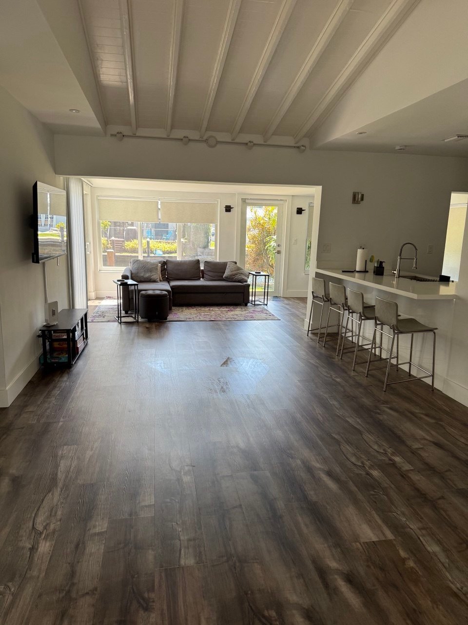 Bright open living room and kitchen cleaned by Cleanantsy